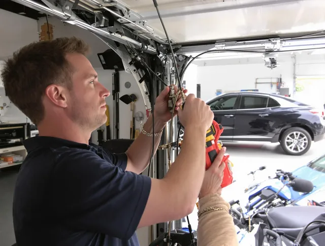Beaumont Garage Door Repair safety certified technician performing cable replacement in Beaumont