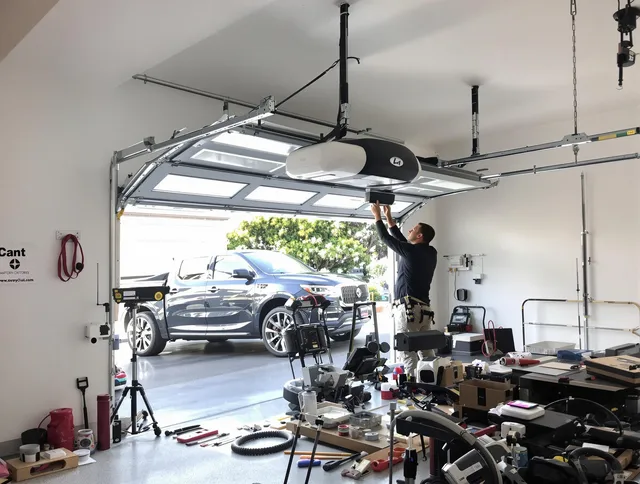 Beaumont Garage Door Repair specialist installing smart garage door opener system in Beaumont home